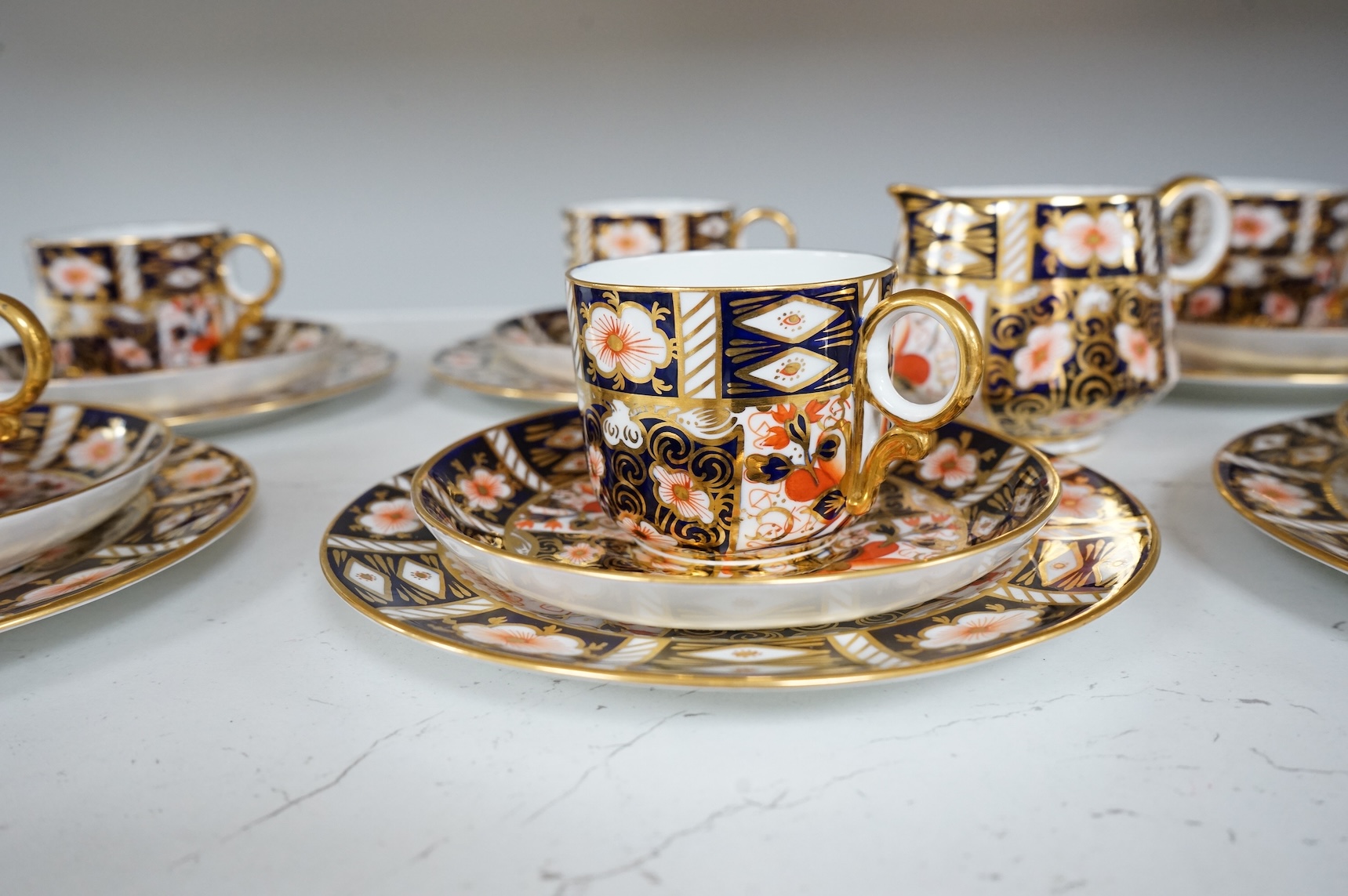 A Royal Crown Derby Imari pattern part tea service to include trios, bowl and jug